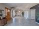 Open-concept living room with tile floors, stylish columns, and plenty of space for entertaining at 1811 E Tierra Buena Ln, Phoenix, AZ 85022