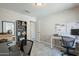 Functional office with desk, ample shelving, and natural light for a productive workspace at 1811 E Tierra Buena Ln, Phoenix, AZ 85022