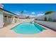 A refreshing pool provides a tranquil escape, set against a backdrop of privacy walls and lush landscaping at 1811 E Tierra Buena Ln, Phoenix, AZ 85022