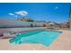 Relaxing pool with tile accents offers a tranquil escape in this beautiful backyard setting at 1811 E Tierra Buena Ln, Phoenix, AZ 85022