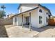 Backyard features a patio, covered porch, and lush landscaping with a small charcoal grill visible near the sliding glass door at 1915 S 39Th St # 37, Mesa, AZ 85206