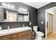Modern bathroom featuring dual vanity, contemporary fixtures, tiled floors and dark walls for a sleek, modern feel at 1915 S 39Th St # 37, Mesa, AZ 85206