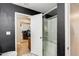 Modern bathroom featuring tiled floors, glass enclosed shower and connection to bedroom at 1915 S 39Th St # 37, Mesa, AZ 85206