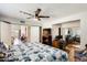 Bright bedroom with hardwood flooring, ceiling fan and closet featuring contemporary design, a work space and natural light at 1915 S 39Th St # 37, Mesa, AZ 85206