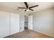 Bright bedroom featuring a ceiling fan and closet, ensuring ample storage at 1915 S 39Th St # 37, Mesa, AZ 85206