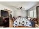 Bright bedroom with hardwood flooring, ceiling fan and ensuite bathroom featuring contemporary design and natural light at 1915 S 39Th St # 37, Mesa, AZ 85206