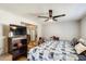 Bright bedroom with hardwood flooring, ceiling fan and closet featuring contemporary design and natural light at 1915 S 39Th St # 37, Mesa, AZ 85206