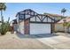 Charming home featuring a two-car garage, red brick accents, desert landscaping, and a palm tree at 1915 S 39Th St # 37, Mesa, AZ 85206