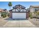 Charming home featuring a two-car garage, red brick accents, and a well-manicured front yard with desert landscaping at 1915 S 39Th St # 37, Mesa, AZ 85206
