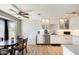 Modern kitchen with white cabinets, stainless steel appliances, and an adjacent dining area with lots of light at 1915 S 39Th St # 37, Mesa, AZ 85206
