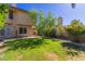 Private backyard with lush green lawn and mature trees, ideal for outdoor relaxation and entertainment at 1946 E Caroline Ln, Tempe, AZ 85284