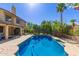 Sparkling blue pool, lush landscaping and plenty of space for outdoor activities make up this backyard at 1946 E Caroline Ln, Tempe, AZ 85284