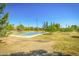 Community basketball court and play area surrounded by green space and ample parking at 1946 E Caroline Ln, Tempe, AZ 85284