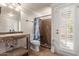 Well-lit bathroom with mosaic tile accents, walk-in shower and direct access to the outdoors at 1946 E Caroline Ln, Tempe, AZ 85284