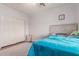 Comfortable bedroom featuring a cozy bed with a stylish headboard and a spacious closet at 1946 E Caroline Ln, Tempe, AZ 85284