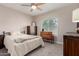 Cozy bedroom with hardwood floors, ceiling fan and a window to provide natural light at 1946 E Caroline Ln, Tempe, AZ 85284