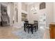 Dining room with stairway, wet bar, chandelier and room for four chairs at 1946 E Caroline Ln, Tempe, AZ 85284
