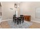 Dining room with a large chandelier and view to the kitchen at 1946 E Caroline Ln, Tempe, AZ 85284