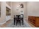 Dining room with chandelier, wet bar and table with four chairs at 1946 E Caroline Ln, Tempe, AZ 85284