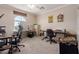Spacious home office with ample natural light and plenty of room for multiple desks at 1946 E Caroline Ln, Tempe, AZ 85284
