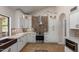 Stylish kitchen featuring white cabinetry, modern appliances, and a unique backsplash, creating a chef's dream space at 1946 E Caroline Ln, Tempe, AZ 85284