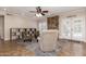 Cozy living room with tile floors, ceiling fan, and access to the outdoors at 1946 E Caroline Ln, Tempe, AZ 85284