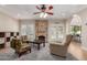 Bright and airy living room boasts a fireplace and access to the outdoors at 1946 E Caroline Ln, Tempe, AZ 85284