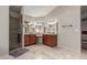 Bathroom featuring double vanities, granite countertops, and a tiled walk-in shower with a glass door at 1946 E Caroline Ln, Tempe, AZ 85284