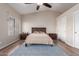 Bright main bedroom with hardwood floors, vaulted ceilings, closet and large windows for natural light at 1946 E Caroline Ln, Tempe, AZ 85284