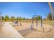 Playground featuring swing sets and seesaws for outdoor activities in a community setting at 1946 E Caroline Ln, Tempe, AZ 85284