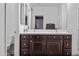 Bathroom vanity features dual sinks, a large mirror, plenty of cabinet space and decorative hardware at 20251 W Hadley St, Buckeye, AZ 85326