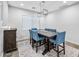Dining area featuring a large table with eight seats, a wooden buffet, and neutral decor at 20251 W Hadley St, Buckeye, AZ 85326
