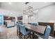 Formal dining room with seating for eight, and stairway to the second floor at 20251 W Hadley St, Buckeye, AZ 85326