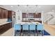Modern kitchen with stainless steel appliances, ample counter space, and an island with seating at 20251 W Hadley St, Buckeye, AZ 85326