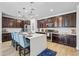 View of kitchen features stainless steel appliances, central island, and modern fixtures at 20251 W Hadley St, Buckeye, AZ 85326