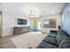 Comfortable living room with a large rug, modern furniture and plenty of natural light at 20251 W Hadley St, Buckeye, AZ 85326