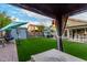 Backyard featuring artificial turf, a shed, a gazebo, and a hot tub at 2038 N Los Alamos St, Mesa, AZ 85213