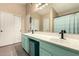 Well-lit bathroom featuring double sinks, modern faucets, and ample counter space at 2038 N Los Alamos St, Mesa, AZ 85213