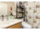 Bathroom featuring single sink vanity and a bathtub/shower with a fun shower curtain at 2038 N Los Alamos St, Mesa, AZ 85213