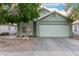 Charming single-story home with a wide driveway, two-car garage, and desert landscaping at 2038 N Los Alamos St, Mesa, AZ 85213