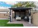 Backyard gazebo featuring comfortable seating, perfect for outdoor relaxation and entertaining at 2038 N Los Alamos St, Mesa, AZ 85213