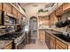 Functional kitchen with stainless steel appliances, ample cabinet space, and tiled flooring at 2038 N Los Alamos St, Mesa, AZ 85213