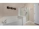 Relaxing bathroom with separate tub and glass shower, plus bright natural light at 20660 N 40Th St # 1118, Phoenix, AZ 85050