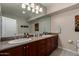 Bathroom featuring double sinks and a granite countertop offers plenty of space at 20660 N 40Th St # 1118, Phoenix, AZ 85050