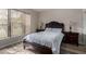 Bright bedroom features wood-look floors, natural light, and neutral décor at 20660 N 40Th St # 1118, Phoenix, AZ 85050