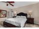 Cozy primary bedroom features natural light, wood-look floors, and neutral décor at 20660 N 40Th St # 1118, Phoenix, AZ 85050