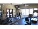Community fitness center with treadmills, weight machines, and large windows at 20660 N 40Th St # 1118, Phoenix, AZ 85050