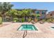 Community hot tub surrounded by lush landscaping and lounge chairs; creating a relaxing oasis at 20660 N 40Th St # 1118, Phoenix, AZ 85050