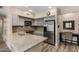 Well-lit kitchen with stainless steel appliances and light countertops offers a modern design at 20660 N 40Th St # 1118, Phoenix, AZ 85050