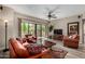 Bright living room with hardwood floors, a ceiling fan, and sliding glass doors to the outdoor patio at 20660 N 40Th St # 1118, Phoenix, AZ 85050